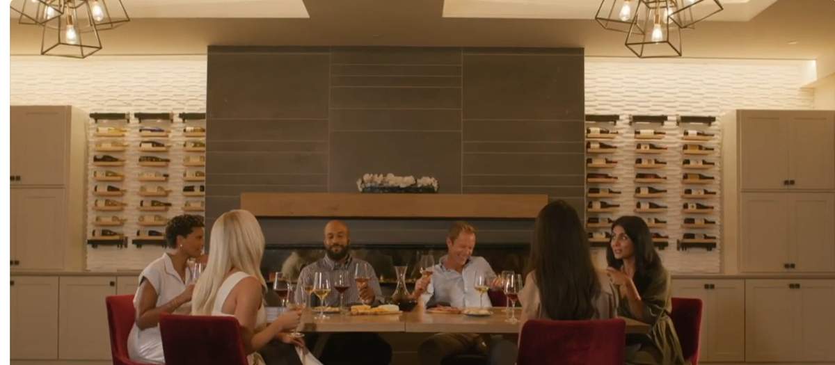 Residents gathered in the wine room at Esplanade's Culinary Center, real photo