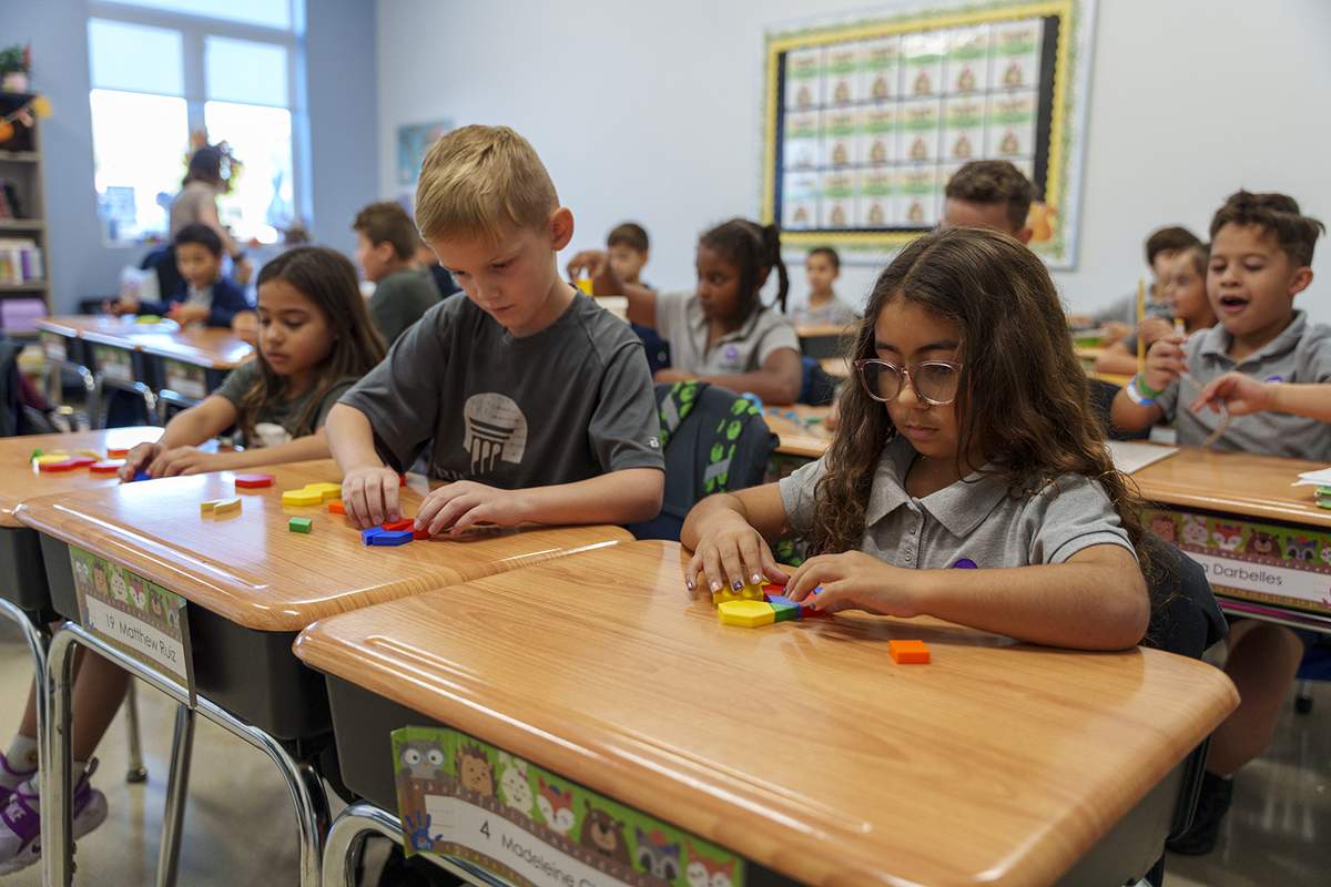 Students working at their desks in a True North Classical Academy classroom